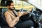 Indian businessman man is sitting in a car. The consultant holds the phone and calls the client. The manager is happy to use the