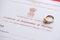 Indian Certificate of registration of marriage blank document and wedding ring on table
