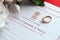 Indian Certificate of registration of marriage blank document and wedding ring on table