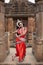 Indian classical dance.Beautiful Odissi dancer posing at mukteshwar temple