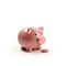 Indian clay piggy bank with human hand finger dropping coin on white background