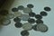 Indian coins spred on a canvas bord
