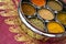 Indian Cookery Spices in Silver Pots on Pink Saree