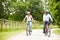 Indian Couple On Cycle Ride In Countryside