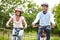 Indian Couple On Cycle Ride In Countryside