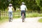 Indian Couple On Cycle Ride In Countryside