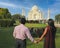 Indian Couple holding hands in love with beautiful Tajmahal Agra. Love. Valentine.