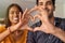 Indian couple making heart with hands