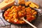 Indian cuisine: curry pumpkin on a plate close-up. horizontal