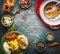 Indian cuisine food background with various traditional specialties meal and colorful spices on rustic background, top view
