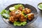 Indian cuisine Indian food. pakora traditional Indian deep-fried snack. pakoras on black plate with coconut chutney