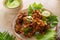 Indian cuisine Indian food. pakora traditional Indian deep-fried snack. pakoras on black plate with coconut chutney