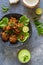 Indian cuisine, Indian food. pakora traditional Indian deep-fried snack. pakoras on black platter with coconut chutney