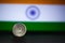 Indian currency - Indian 10 Paisa coin rupee isolated on india flag background. old ten paisa coin with space for copy text