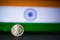 Indian currency - Indian 10 Paisa coin rupee isolated on india flag background. old ten paisa coin with space for copy text