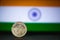 Indian currency - Indian twenty Paisa coin rupee isolated on india flag background. old 25 paisa coin 1979 with space for copy