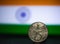 Indian currency - Indian twenty Paisa coin rupee isolated on india flag background. old 25 paisa coin 1979 with space for copy