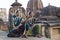 Indian dancer. Two odissi dancers wearing head gear,jewelry and posing in front of Mukteshvara Temple,Bhubaneswar, Odisha.