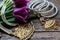 Indian decorations for dancing: bracelets, necklace. Purple ultraviolet tulips on old rustic wooden background