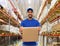 Indian delivery man or warehouse worker with box