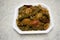 Indian dish Bhindi do pyaza top view, Ladyfinger or Okra home cooked with onions, tomatoes and masala spices, red chilles.