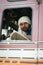 Indian driver in white turban in the cabin of his truck