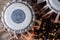 Indian drums and cymbals on a textured background.