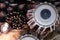 Indian drums and cymbals on a textured background - top down view.