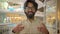 Indian excited happy surprised cheerful man buyer client customer businessman Arabian bearded guy in glasses open