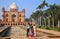 Indian family standing in front of Tomb of Safdarjung in New Del