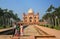 Indian family standing in front of Tomb of Safdarjung in New Del