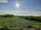 An indian farm , clouds , sun