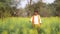 Indian farmer at black mustard field