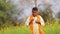 Indian farmer at black mustard field