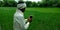 An indian farmer capturing picture of wheat grain grass
