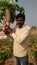 An Indian farmer holding the giant vegetable grown in his field