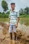 Indian Farmer in Paddy Field.