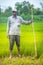 Indian Farmer in Paddy Field.