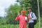 indian farmer showing agro product bottle with agronomist