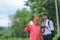 indian farmer showing agro product bottle with agronomist