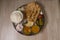 Indian Fasting cuisine Upwas items Thali complere meal for vrat ekadashi.Upawas thali meal with Rajgira puri, paratha,shakarkand