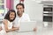 Indian Father & Daughter Using Laptop Computer