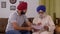 Indian father and son holding documents and discussion work - Paperwork, Finance, Home Loan, Legal Papers