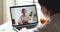 Indian female manager wearing headset consulting customer by webcam videocall