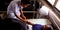 An indian female nurse staff injecting needle into the patient hand during treatment