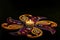 Indian festival Diwali , candle on dark background