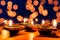 Indian festival Diwali, Diya oil lamps lit on colorful rangoli. Hindu traditional. Happy Deepavali. Copy space for text