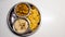 Indian festival platter with sweets and snacks on white background