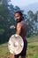 Indian fighter with sword and shield performing Kalaripayattu ma