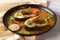 Indian fish curry with vegetables close-up. horizontal